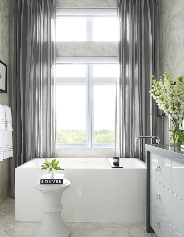 Beautiful bathrooms with dreamy curtains and an expansive view