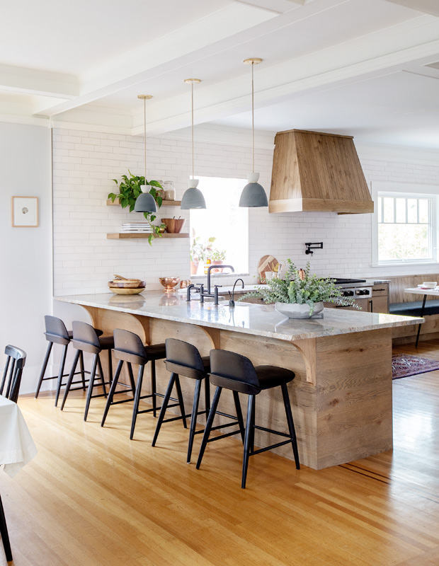 Kyla Bidgood century home kitchen with natural wood cabinets and matching vent hood