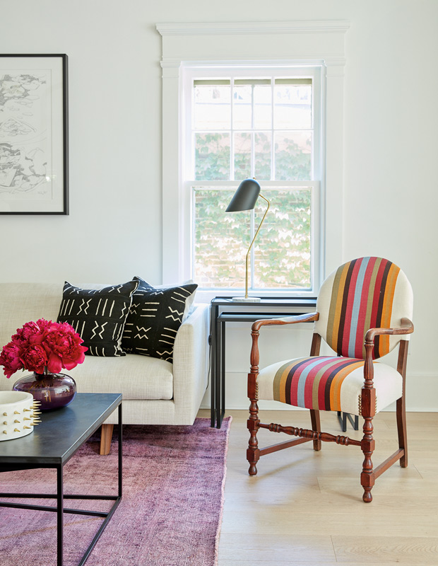Shirley Meisels family home makeover living room with striped vintage chair and graphic pillows