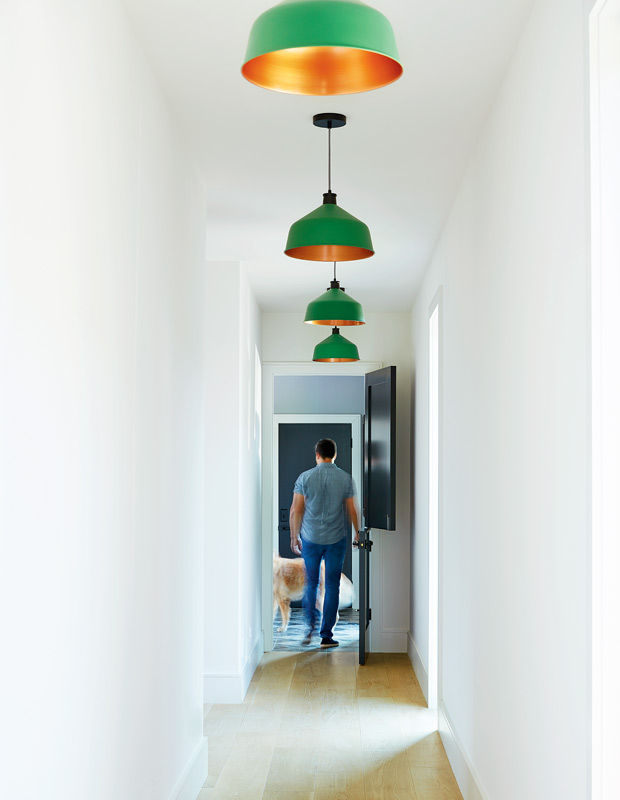 Cameron MacNeil country home hallway with bright green light fixtures