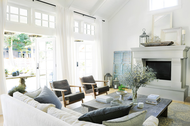 Tracey Ayton west coast home living room with vintage barn door, plenty of natural light and a cool palette