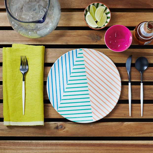 Summer table setting citrus neon colors with striped plate