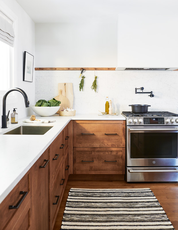 kitchen with natural wood cabinets and a Shaker-style peg rail