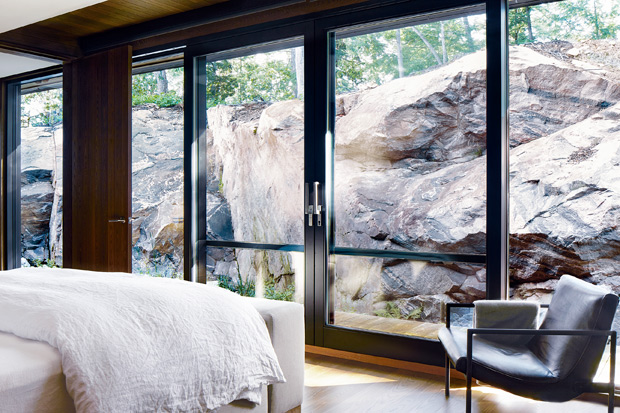 contemporary, nature-inspired cottage bedroom with rocky views