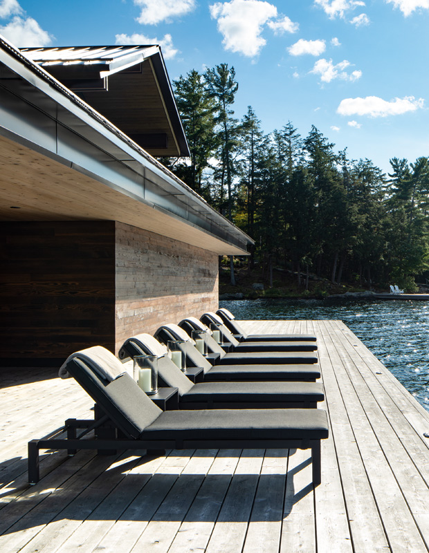 contemporary, nature-inspired cottage dock by the lake