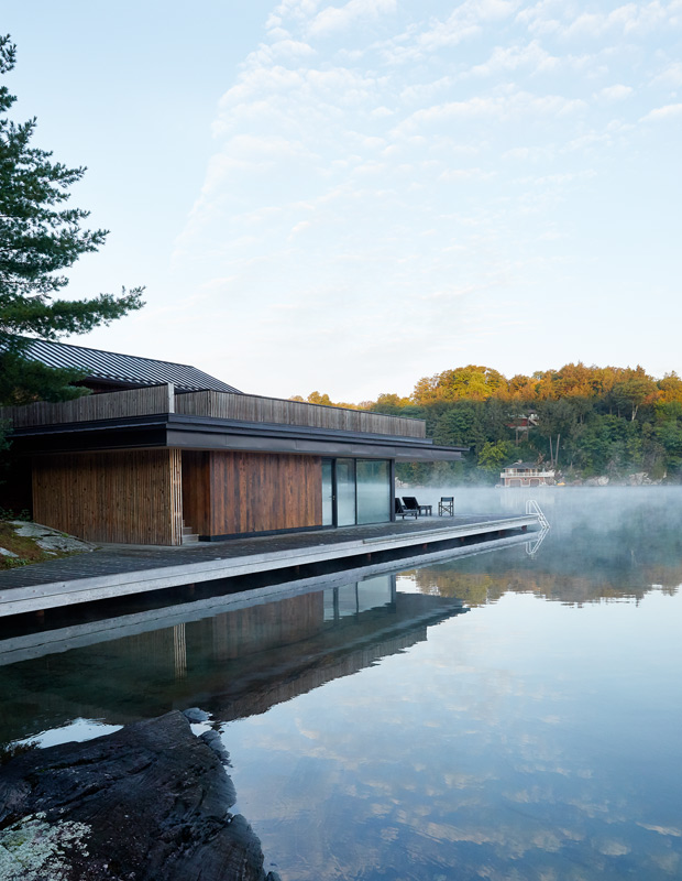 contemporary, nature-inspired cottage exterior on the lake