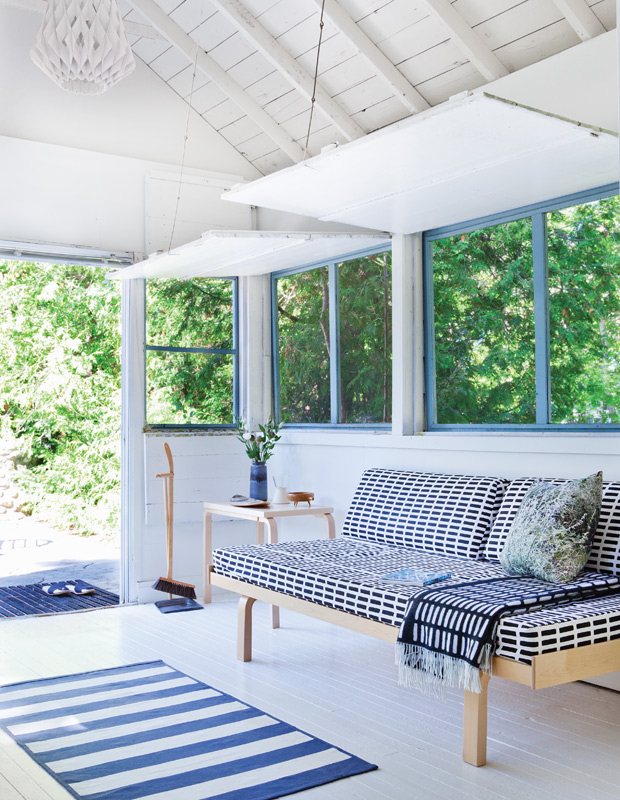 Mjolk Shop country home sunroom has a boathouse feel