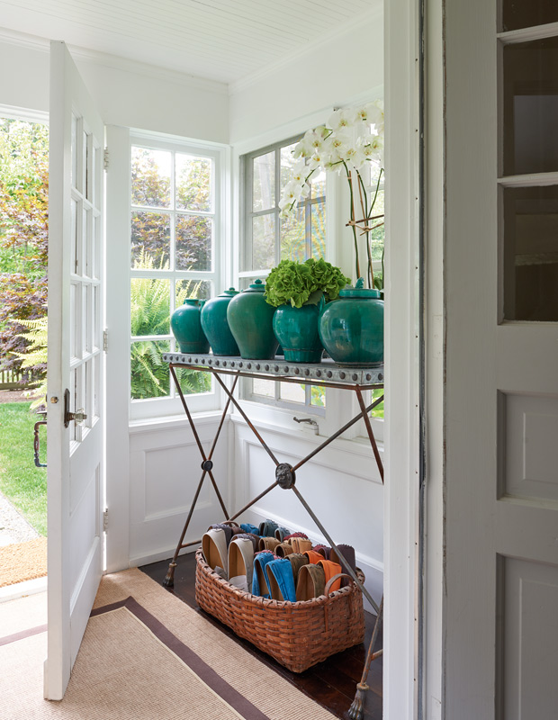 fall organization tips entryway with a shoe-filled basket