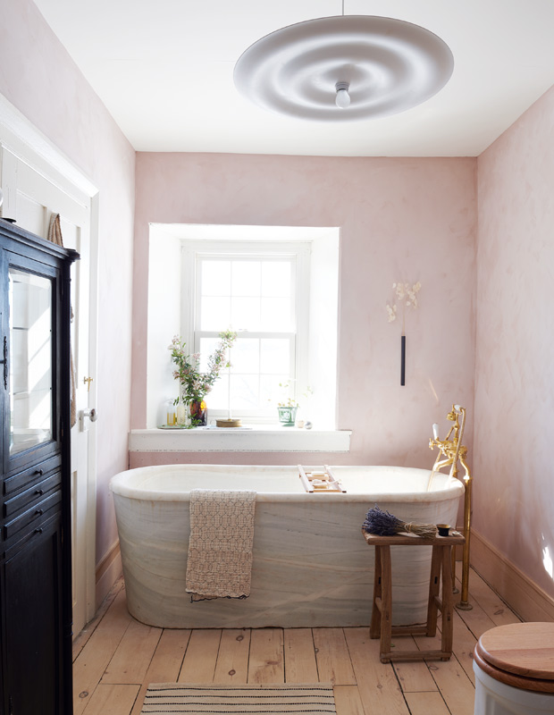 Mjölk country home bathroom with blush pink walls and a marble tub