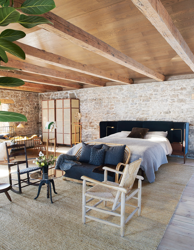 Mjölk country home principal bedroom with exposed beams