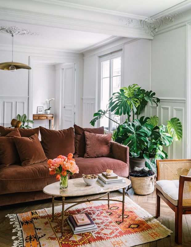 Jackie Kai Ellis Paris apartment living room with rust velvet couch