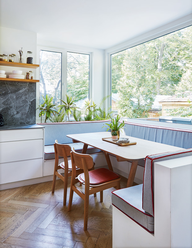 cozy breakfast nook muted banquette with large windows
