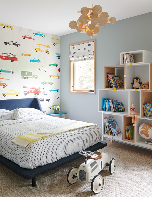 decorated minimalism little boy's bedroom with a car and truck wallpaper