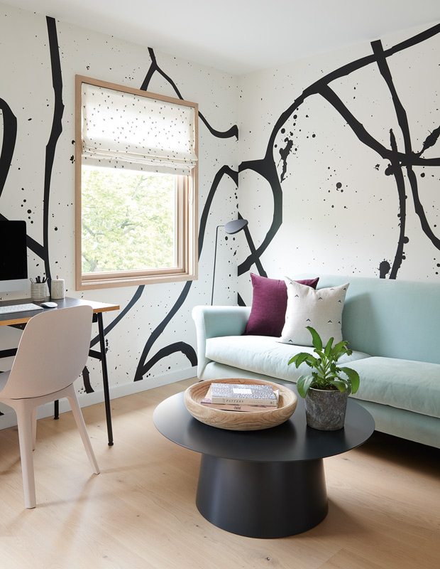 decorated minimalism home office with a graphic, graffiti-like wallpaper