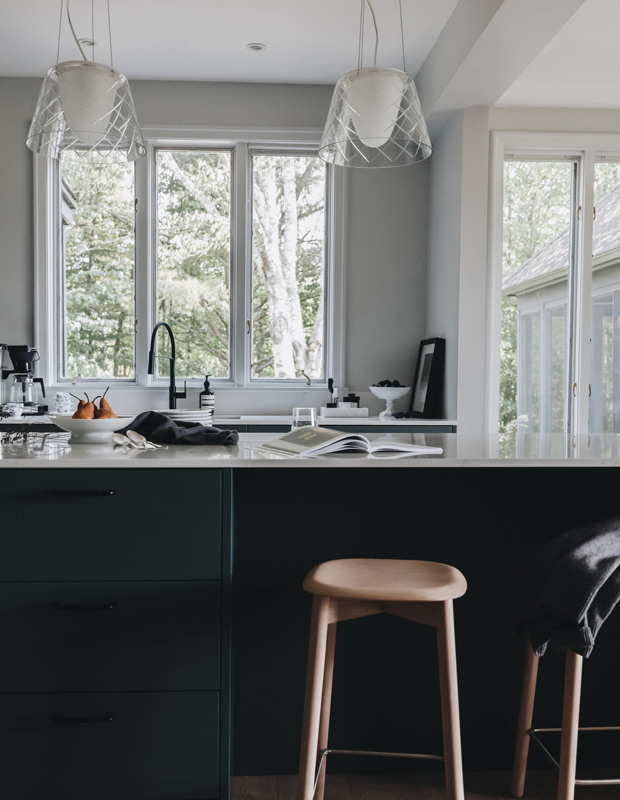 moody nordic kitchen sink, views outside and bar stools