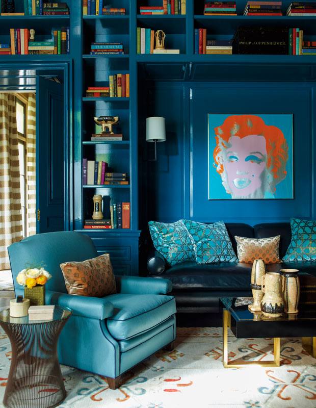 A living room decorated in deep blue shades.