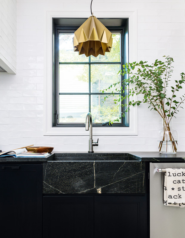 high-contrast kitchen apron-front sink with marble veining