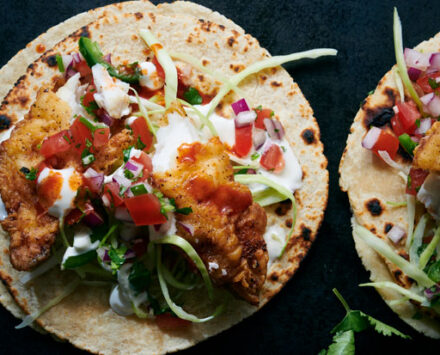 Fish tacos on plates.