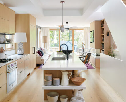decorated minimalism open-concept house with white and wood accents
