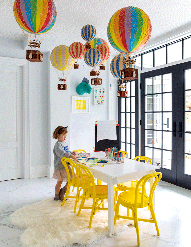 kids' bedroom makeover playroom with yellow chairs and colorful balloons