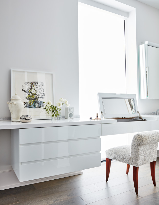 colorful condo vanity with sleek white drawers