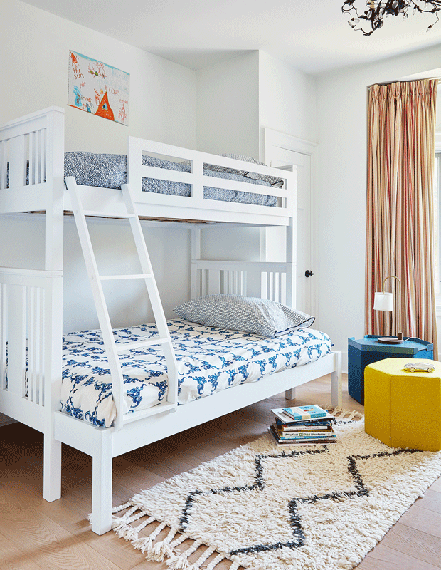 kids' bedroom makeover crisp white bunkbeds with blue patterned sheets