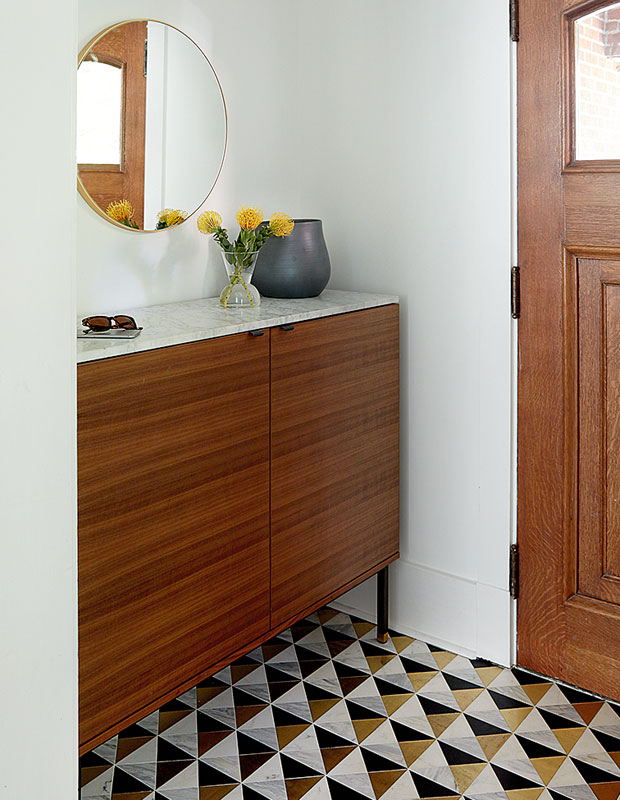 Entryway with gold, white and black square tiled floor
