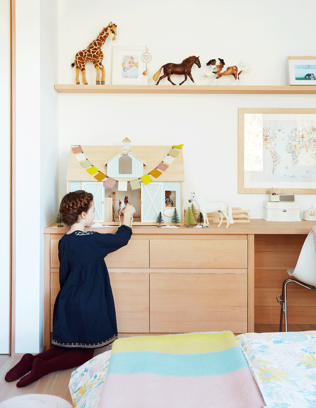 kids' bedroom makeover little girl playing with horses