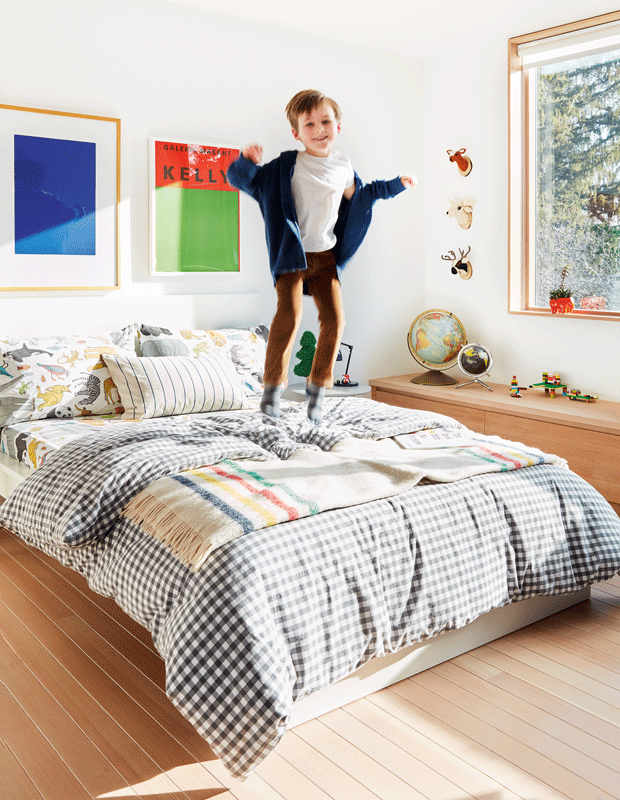 kids' bedroom makeover little boy jumping on his bed