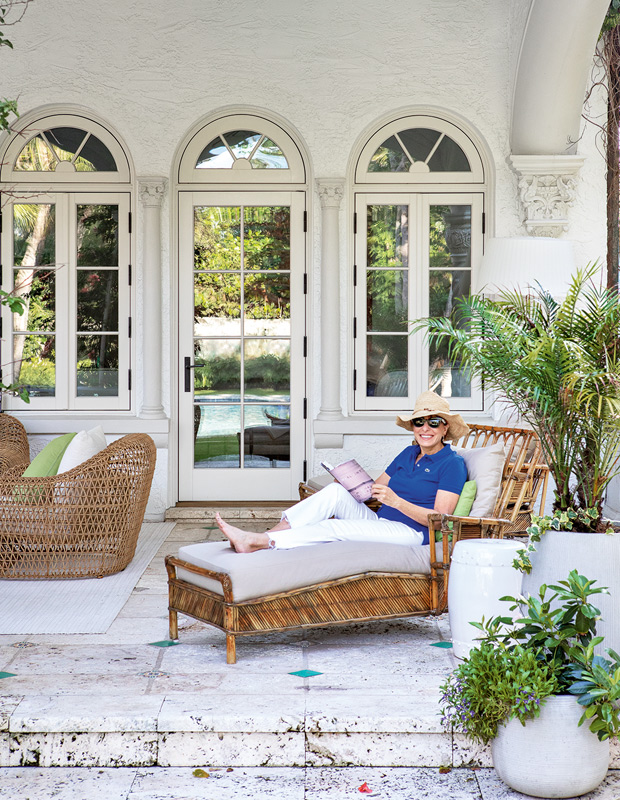 palm beach home homeowner lying on a lounger