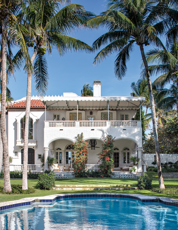 palm beach home exterior shot with pool and palm trees