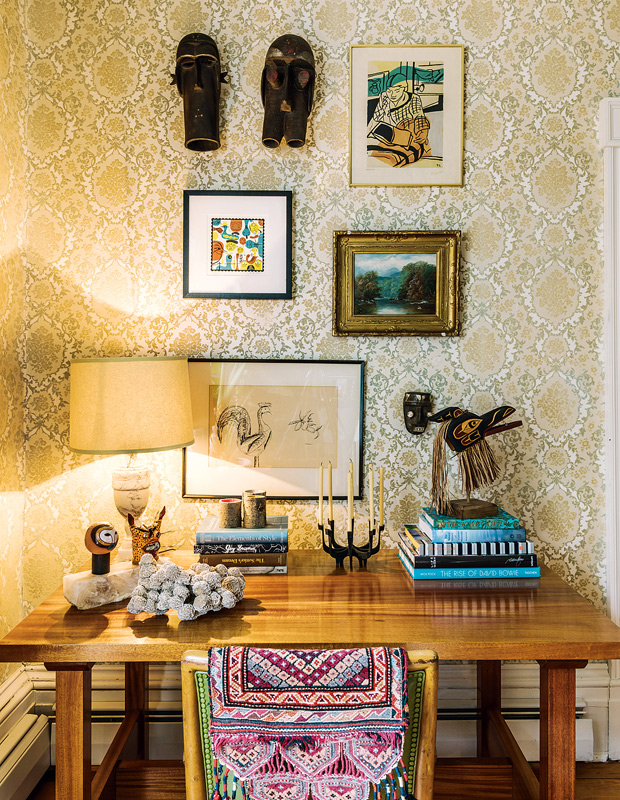 global style vignette with masks and Moroccan-inspired blankets