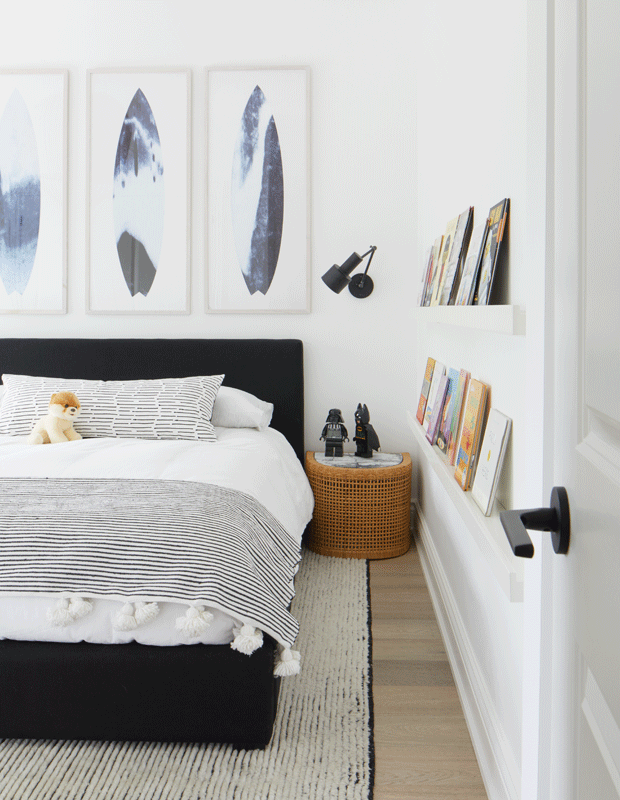 kids' bedroom makeover surf-inspired with books on the wall