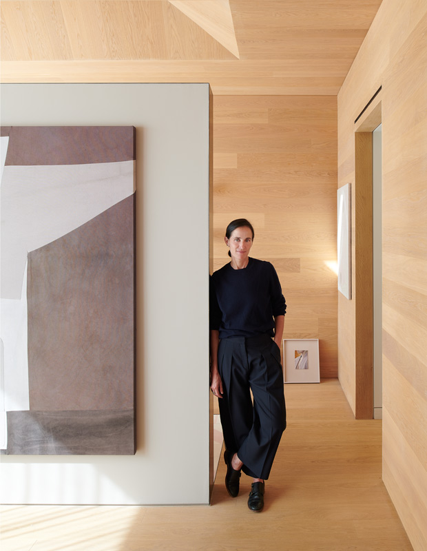 artful home homeowner Pamela Meredith standing in the principal bedroom