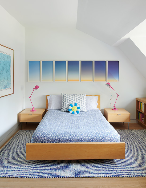 artful home kids' bedroom with wood bed frame and side tables and sunset artwork