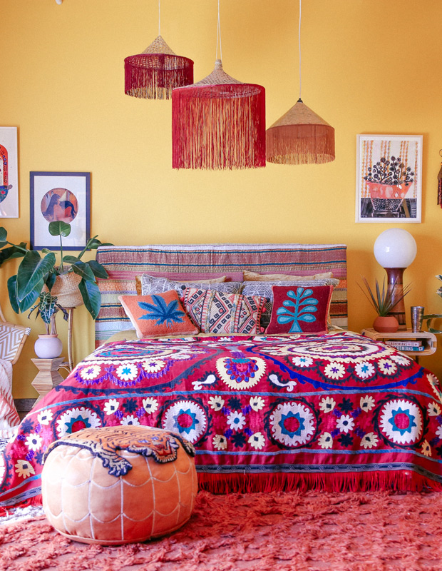 Justina Blakeney bright yellow bedroom with bold red, pink and orange accents