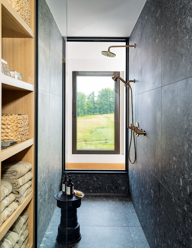 Bathroom with a black marble tile shower