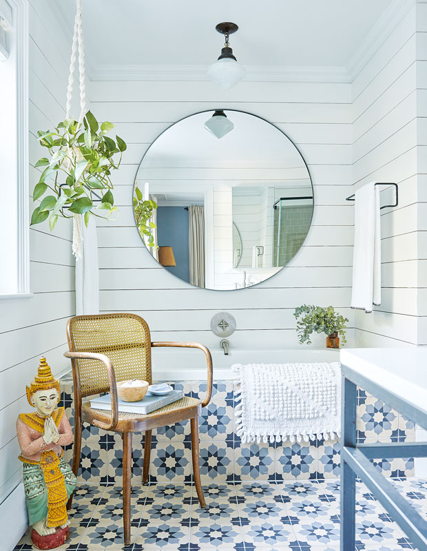 Bathroom with a bold blue and white tiled tub