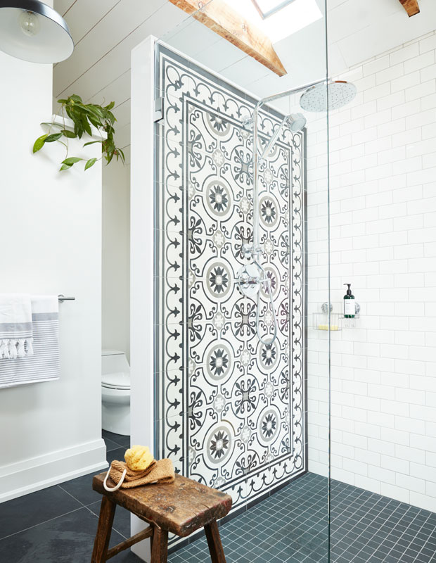 Bathroom with a decorative tile shower wall