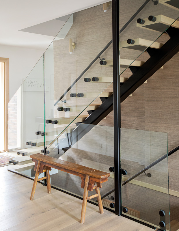 entryway with glass stairs