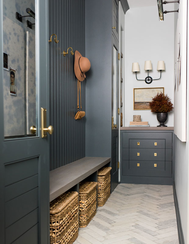 Mudroom with blue grey paint and a nook for changing shoes