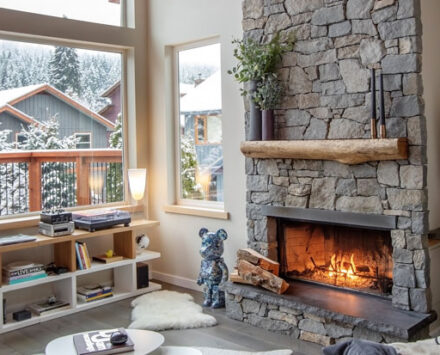 A living room with a stone fireplace Inside a B.C. Retailer's Cozy Living Room