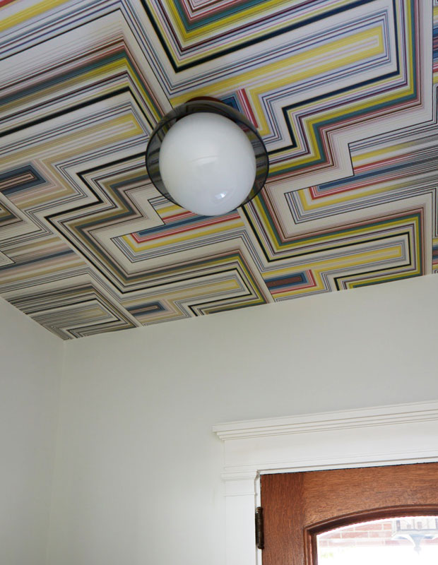 Entryway ceiling with multi-colored striped wallpaper