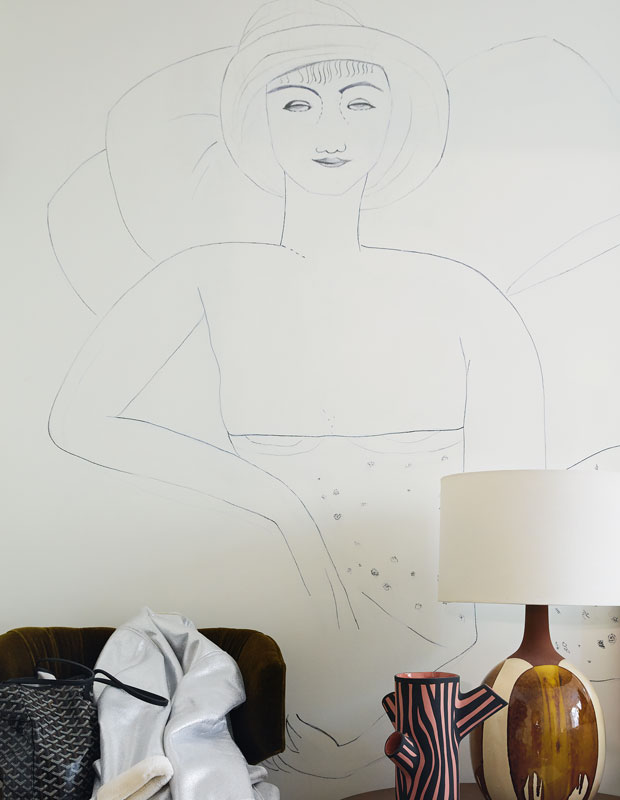 Wall "tattoo" of a fashionable woman printed on the wall of the principle bedroom.