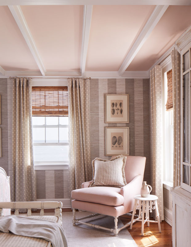 Soft pink bedroom with a pale pink ceiling that has white wood panels running across it