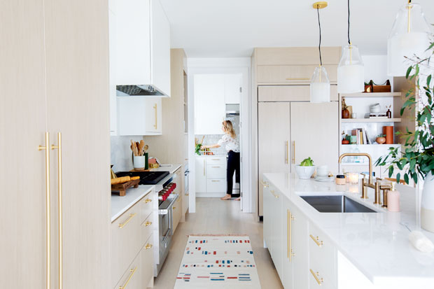 Open Concept Kitchen with a hidden prep area where designer Tanya Krpan is preparing food