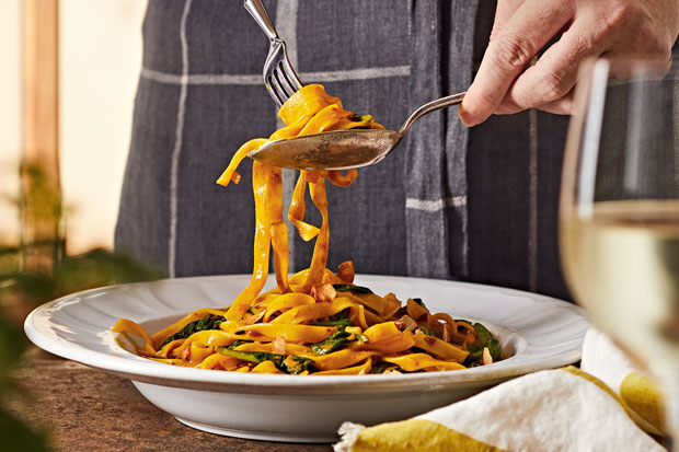 Golden Tagliatell & Greens in a dish.
