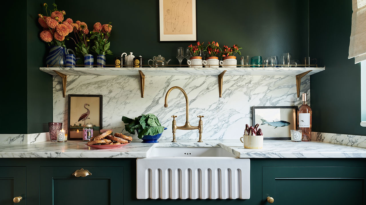 sage green kitchen wall with brown cabinet