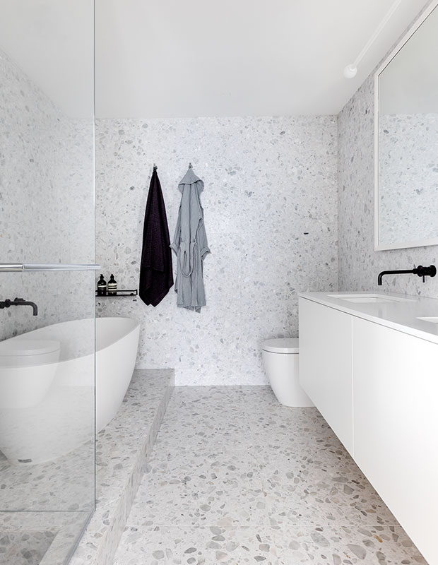 terrazzo tile in bathroom with freestanding tub