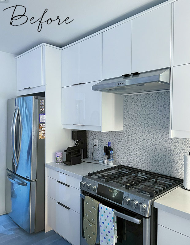 Before: a slightly dated kitchen with white cabinets, micro-mosaic tiles, and modern hardware. little italy home renovation